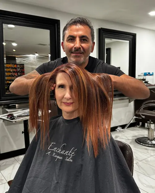 Murat Tercan, Director and Owner of Enchante A European Salon in Fort Collins, CO, styling a client's hair color